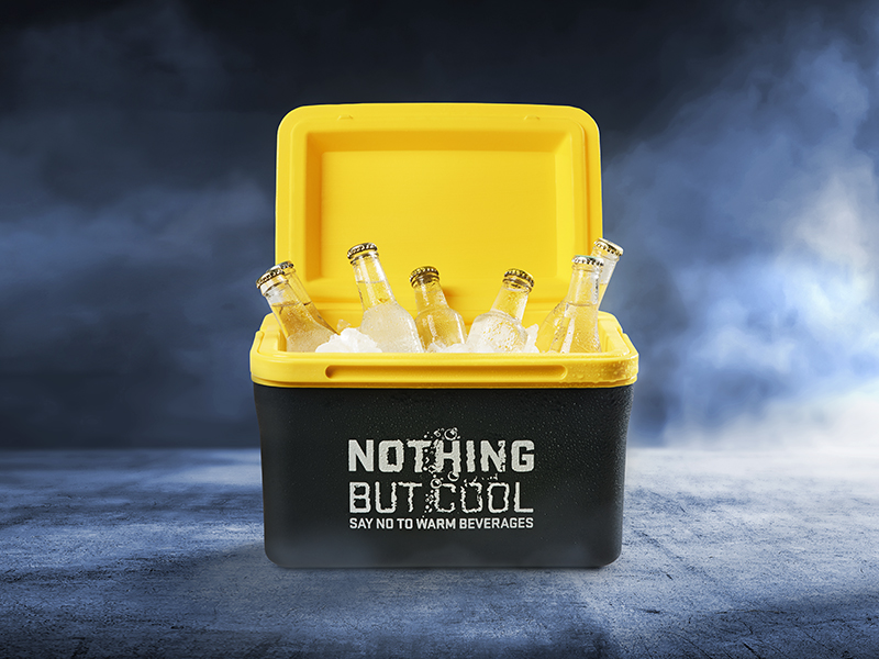 A black and yellow cooler box with the text "Nothing but cool" on it